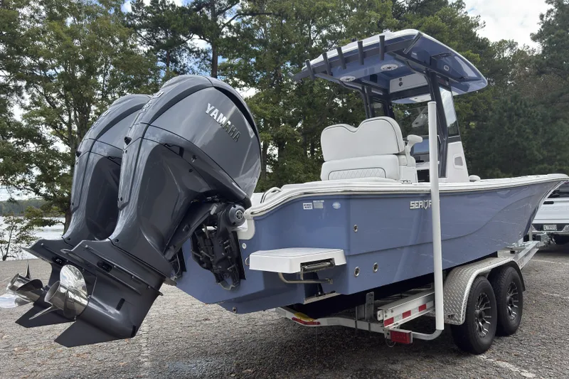 Slide: The Image of 2025 Sea Fox 282 Hybrid LT boat with dual Yamaha engines on a trailer. - 19