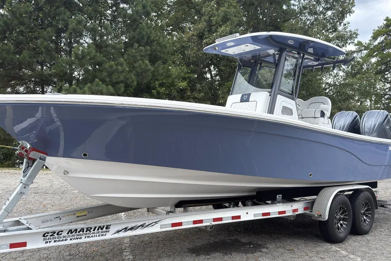 Slide: The Image of 2025 Sea Fox 282 Hybrid LT boat on trailer, parked outdoors. - 3