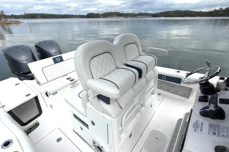 Slide: The Image of 2025 Sea Fox 282 Hybrid LT boat interior with dual engines and luxury seating. - 5