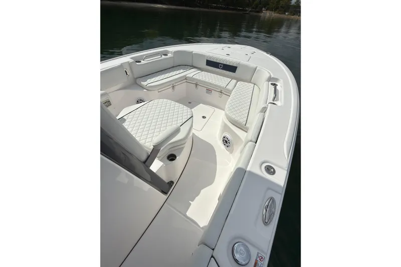 Slide: The Image of 2025 Sea Fox 282 Hybrid LT boat interior with cushioned seating and sleek design. - 9