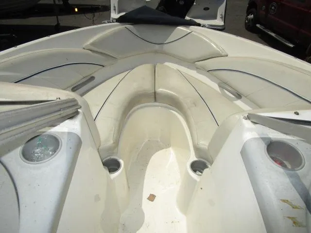 Slide: The Image of 2007 Bayliner 195 Discovery boat interior with seating and cup holders. - 4