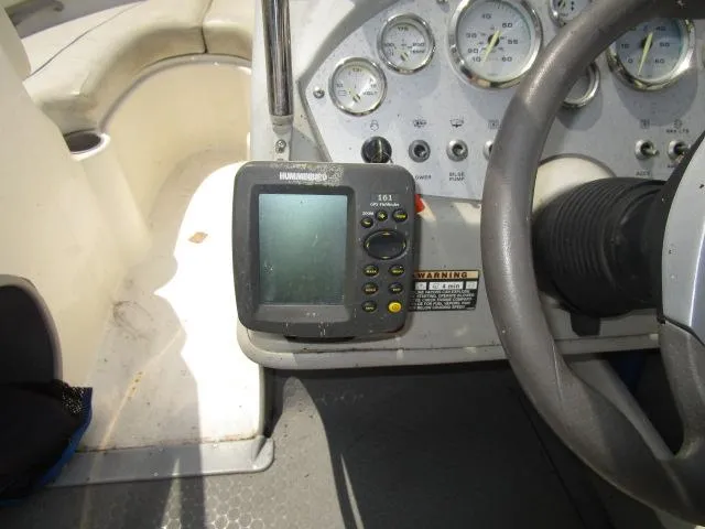 Slide: The Image of 2007 Bayliner 195 Discovery dashboard with gauges and Humminbird fish finder. - 9