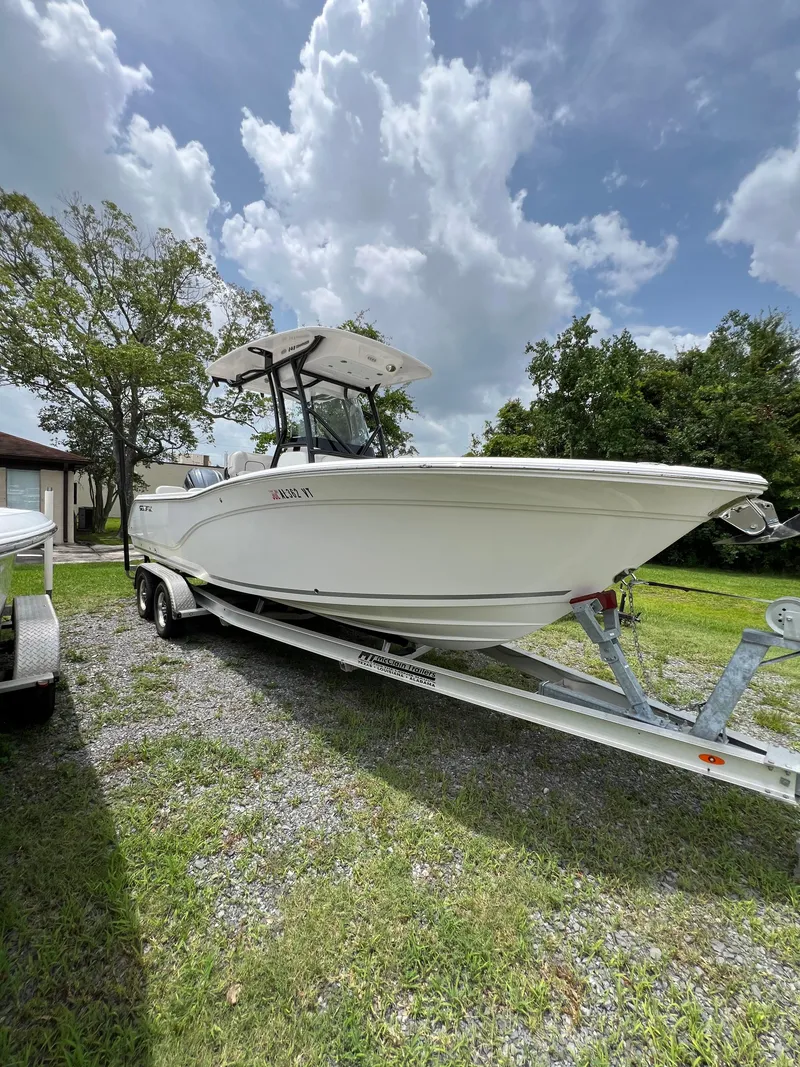 The Image of 2022 Sea Fox 248 Commander boat on trailer under cloudy sky. - 0