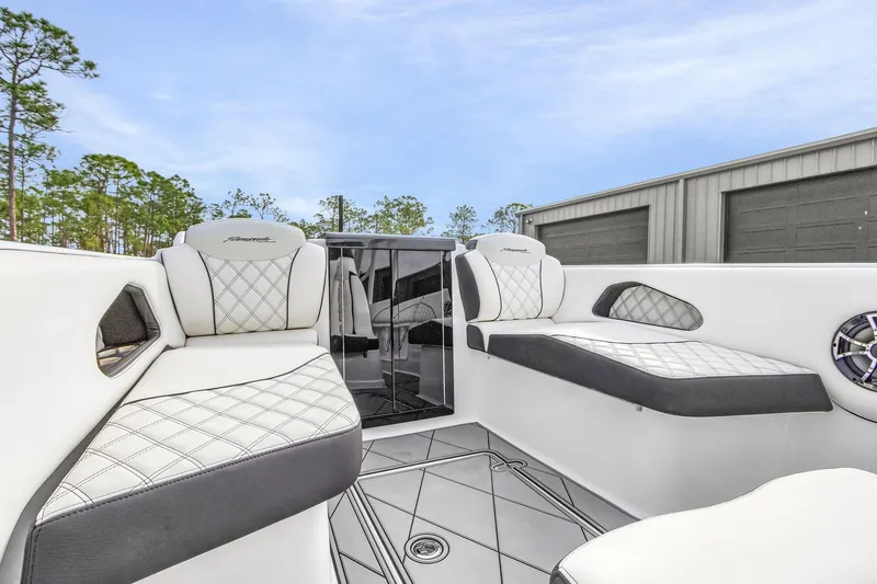 Slide: The Image of 2020 Renegade 32' Cuddy boat interior with white quilted seating and modern design. - 11