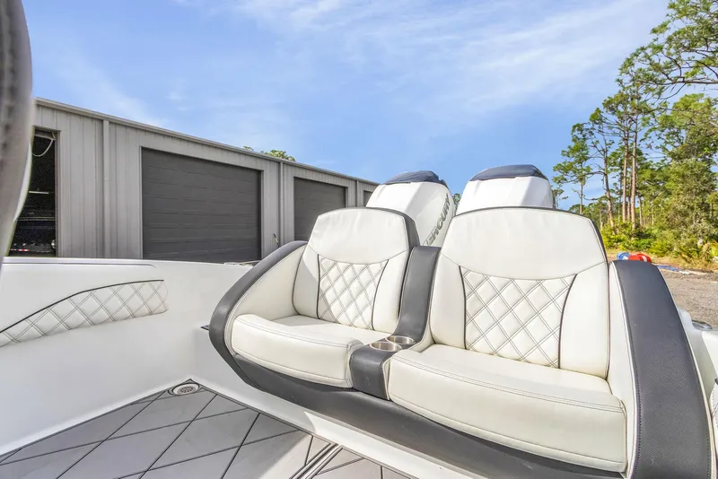 Slide: The Image of Luxurious seating on 2020 Renegade 32' Cuddy boat, featuring elegant white upholstery. - 13