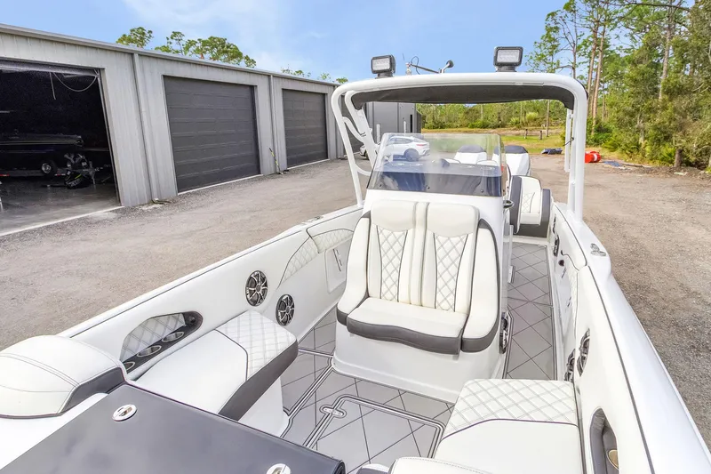 Slide: The Image of 2020 Renegade 32' Cuddy boat with luxurious white seating and modern design. - 19