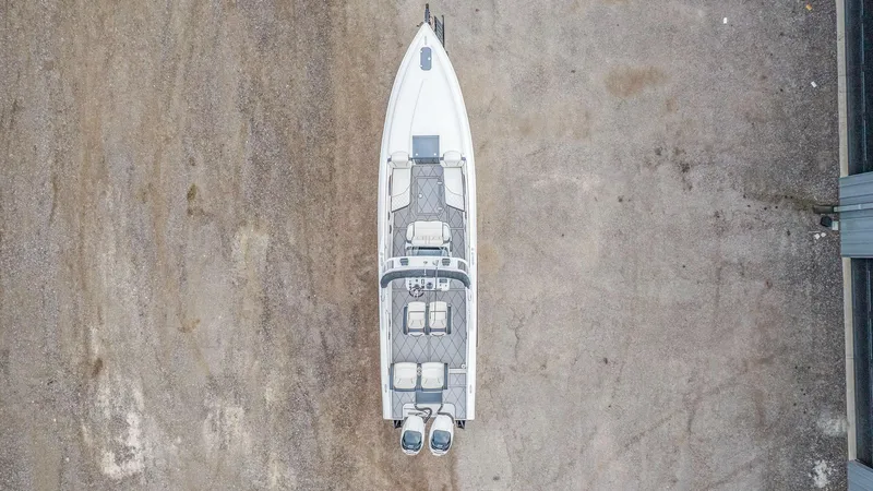 Slide: The Image of Aerial view of 2020 Renegade 32' Cuddy boat on concrete surface. - 26