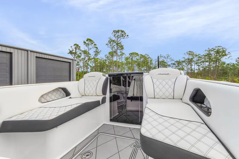 Slide: The Image of 2020 Renegade 32' Cuddy boat interior with white quilted seating and sleek design. - 8
