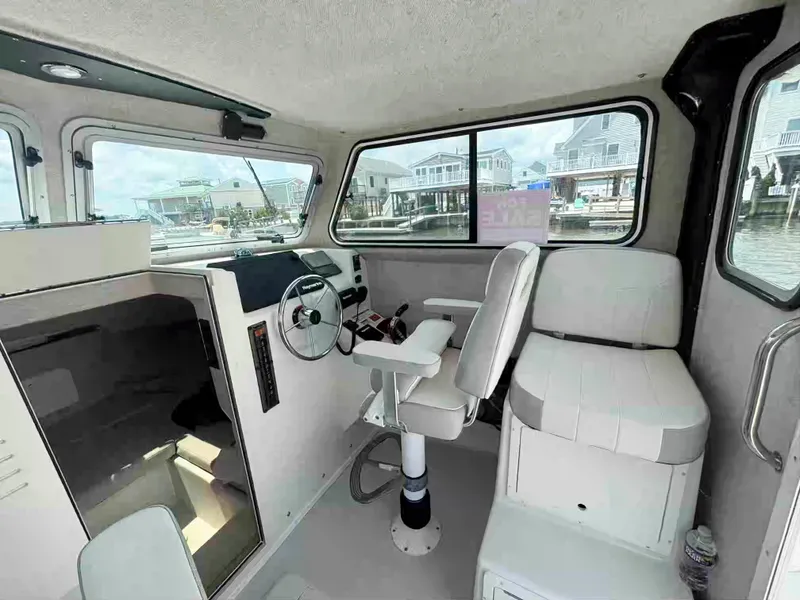 Slide: The Image of 2021 Parker 2520 XLD Sport Cabin interior with steering wheel and seating. - 15