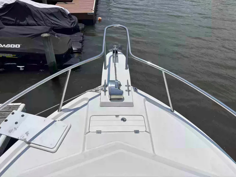 Slide: The Image of Bow view of 2021 Parker 2520 XLD Sport Cabin boat at dock. - 20