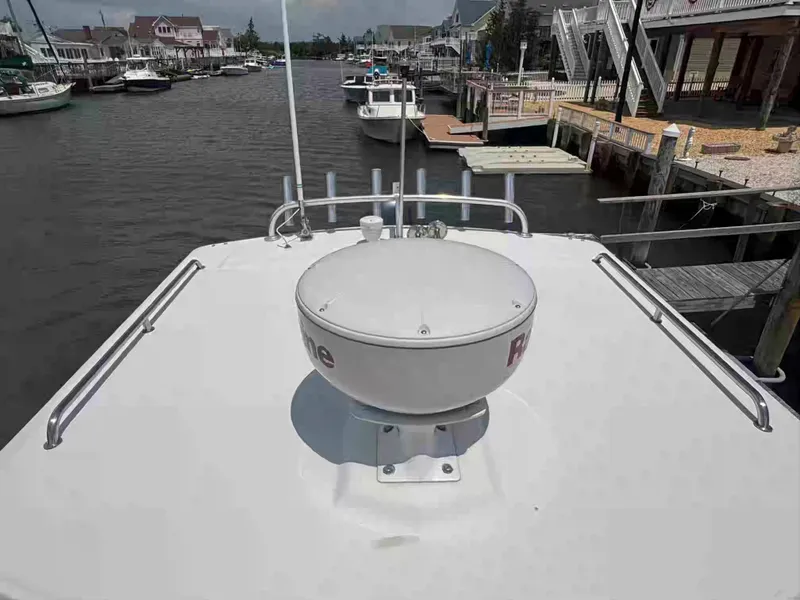 Slide: The Image of 2021 Parker 2520 XLD Sport Cabin boat docked in a marina, view from the deck. - 21