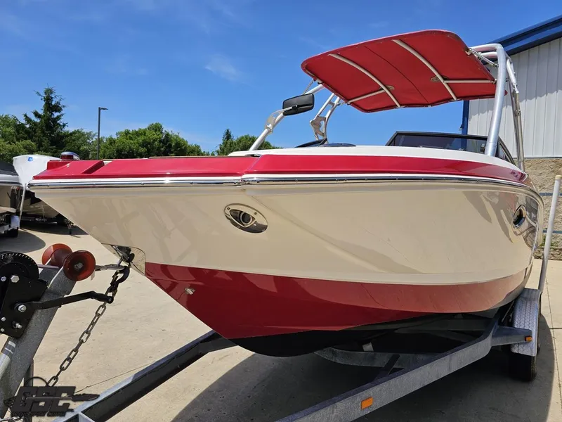 Slide: The Image of 2008 Chaparral Sunesta 224 boat on trailer, red and white design, sunny day. - 13