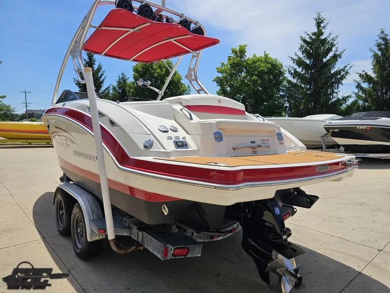Slide: The Image of 2008 Chaparral Sunesta 224 boat on trailer, featuring red accents and a wakeboard tower. - 27