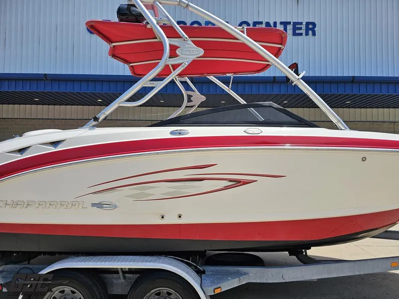Slide: The Image of 2008 Chaparral Sunesta 224 boat with red accents on a trailer. - 3