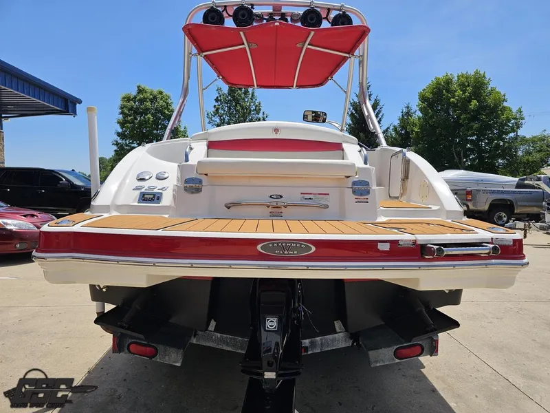 Slide: The Image of 2008 Chaparral Sunesta 224 boat with red accents, docked on a sunny day. - 32