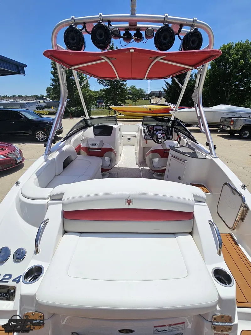 Slide: The Image of 2008 Chaparral Sunesta 224 boat interior with red accents and seating. - 33