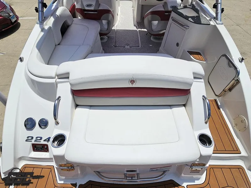 Slide: The Image of 2008 Chaparral Sunesta 224 boat interior with white seating and wood accents. - 34