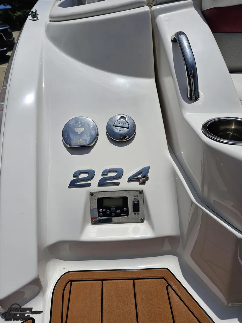 Slide: The Image of 2008 Chaparral Sunesta 224 boat deck with controls and branding. - 36