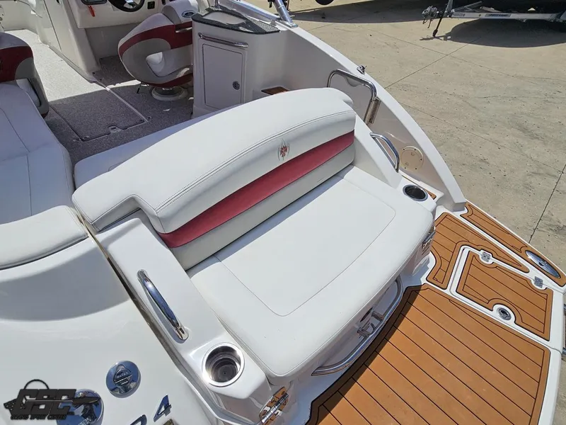 Slide: The Image of 2008 Chaparral Sunesta 224 boat interior with white and red seating, wood-style flooring. - 38