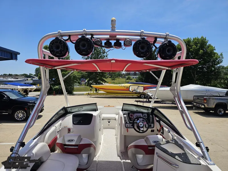Slide: The Image of 2008 Chaparral Sunesta 224 boat interior with red canopy and speaker system. - 43