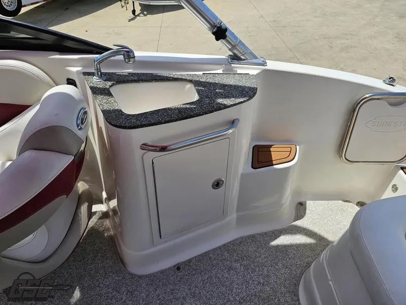 Slide: The Image of 2008 Chaparral Sunesta 224 boat interior with sink and seating area. - 45