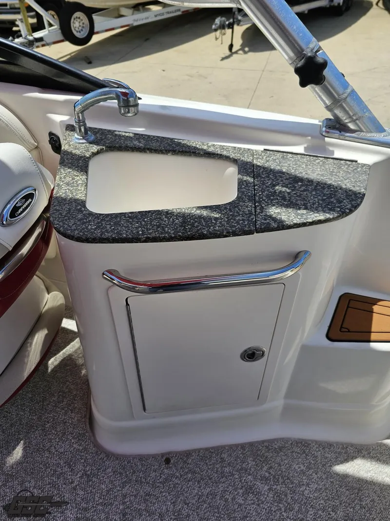 Slide: The Image of 2008 Chaparral Sunesta 224 boat sink with granite countertop and storage cabinet. - 46