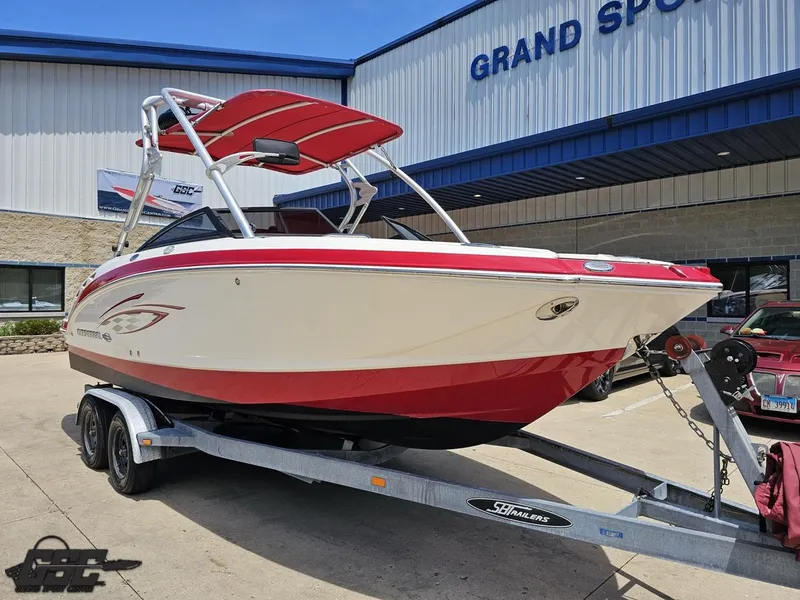 Slide: The Image of 2008 Chaparral Sunesta 224 boat on trailer, parked outside Grand Sports Center. - 9