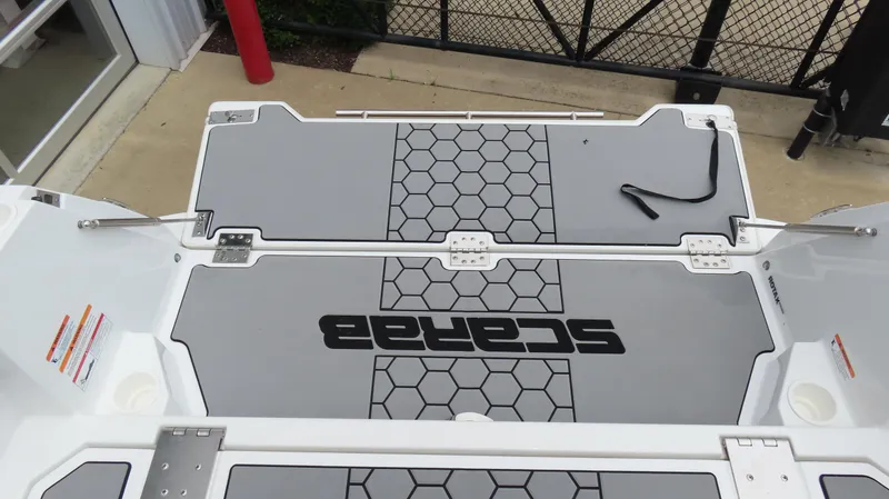 Slide: The Image of 2020 Scarab 255 Open G boat deck with hexagonal pattern and logo. - 10