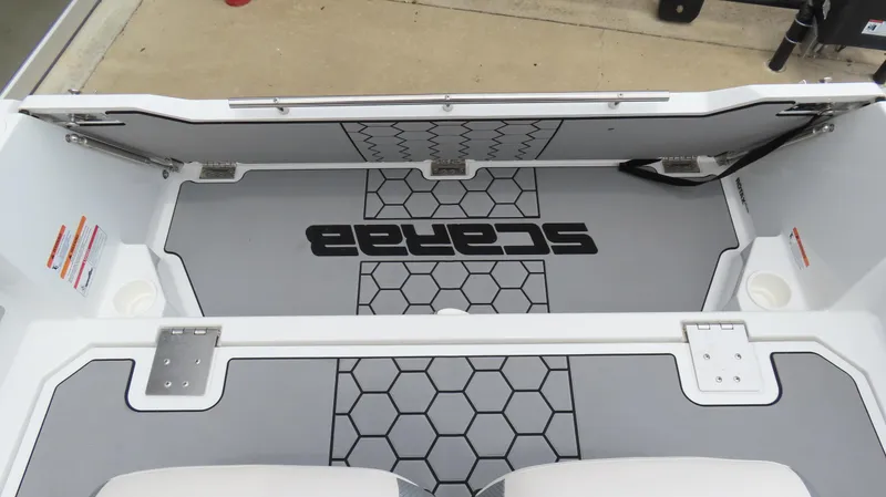 Slide: The Image of 2020 Scarab 255 Open G boat interior with hexagonal pattern flooring. - 12