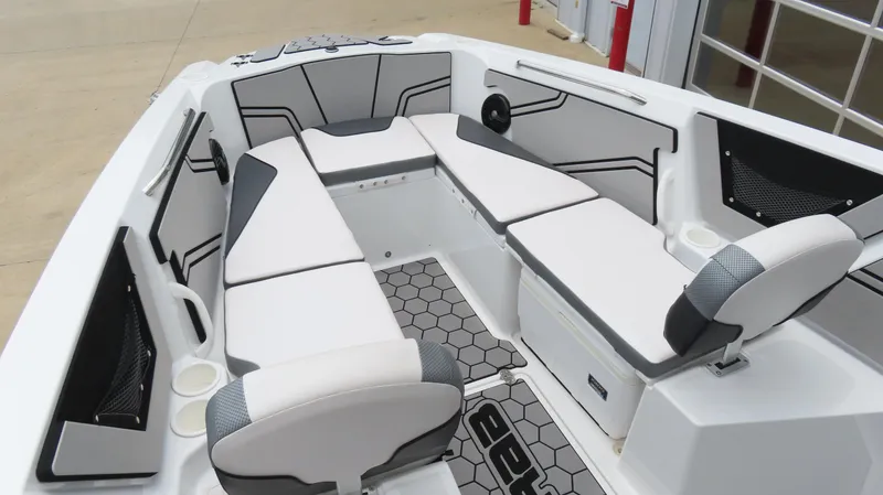 Slide: The Image of 2020 Scarab 255 Open G boat interior with white seating and hexagonal floor design. - 21