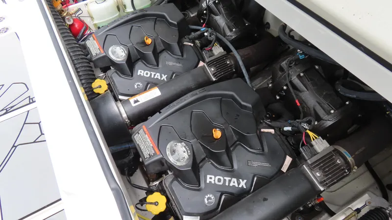 Slide: The Image of Engine compartment of a 2020 Scarab 255 Open G with dual Rotax engines. - 25