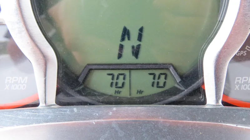 Slide: The Image of Dashboard of 2020 Scarab 255 Open G showing 70 hours on display. - 26