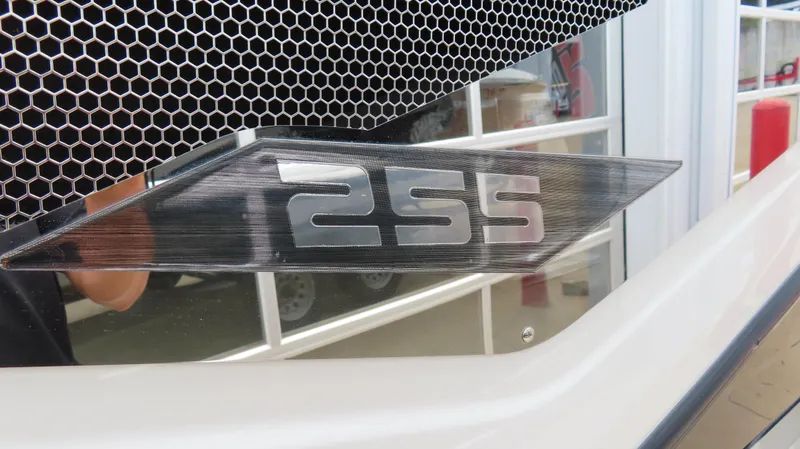 Slide: The Image of Close-up of 2020 Scarab 255 Open G boat emblem with honeycomb grille. - 8