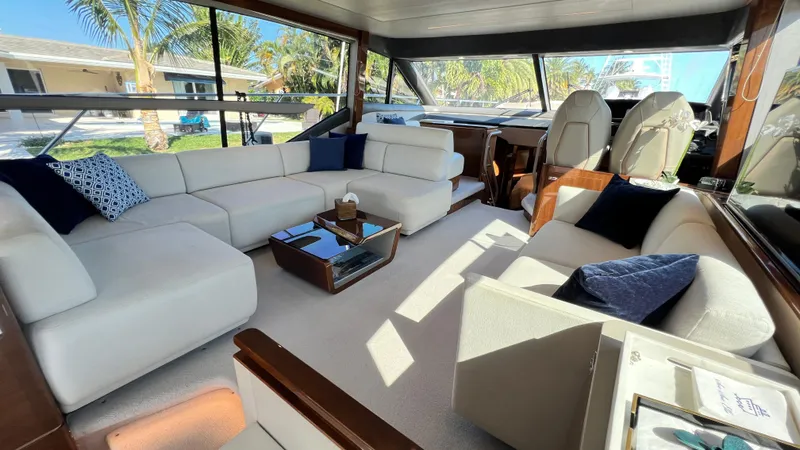Slide: The Image of Luxurious interior of 2019 Princess F62 yacht with elegant seating and panoramic windows. - 12