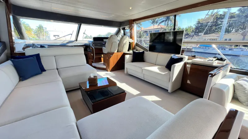 Slide: The Image of Luxurious interior of 2019 Princess F62 yacht with elegant seating and large windows. - 13