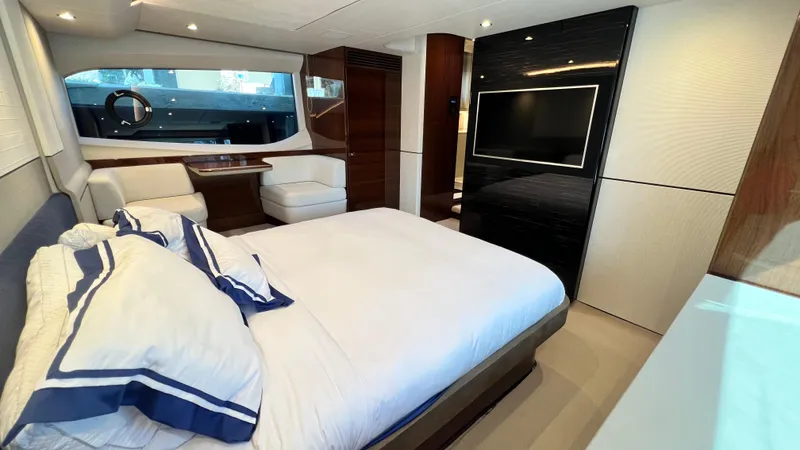 Slide: The Image of Luxurious 2019 Princess F62 yacht bedroom with elegant decor and modern amenities. - 21