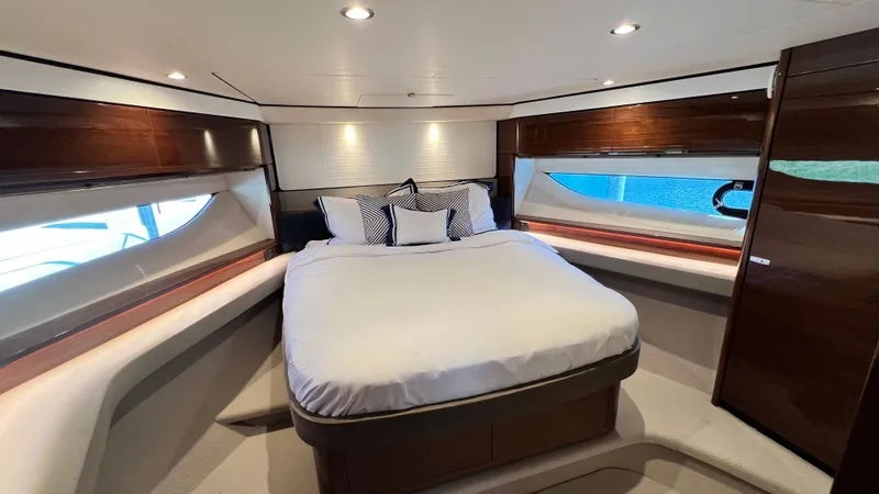Slide: The Image of Luxurious bedroom interior of 2019 Princess F62 yacht with elegant wood finishes. - 26