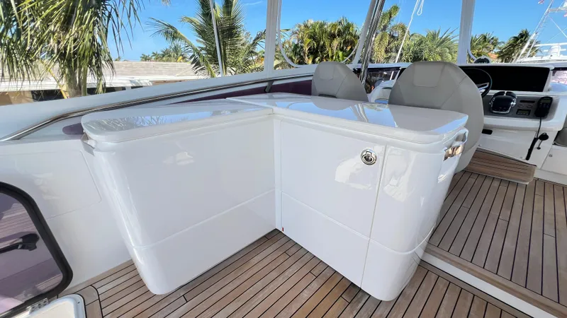 Slide: The Image of 2019 Princess F62 yacht helm with sleek design and wooden deck. - 44