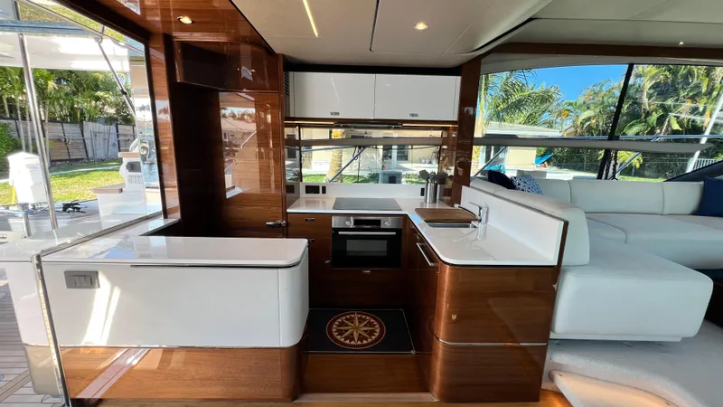 Slide: The Image of Luxurious 2019 Princess F62 yacht interior with modern kitchen and elegant wood finishes. - 6