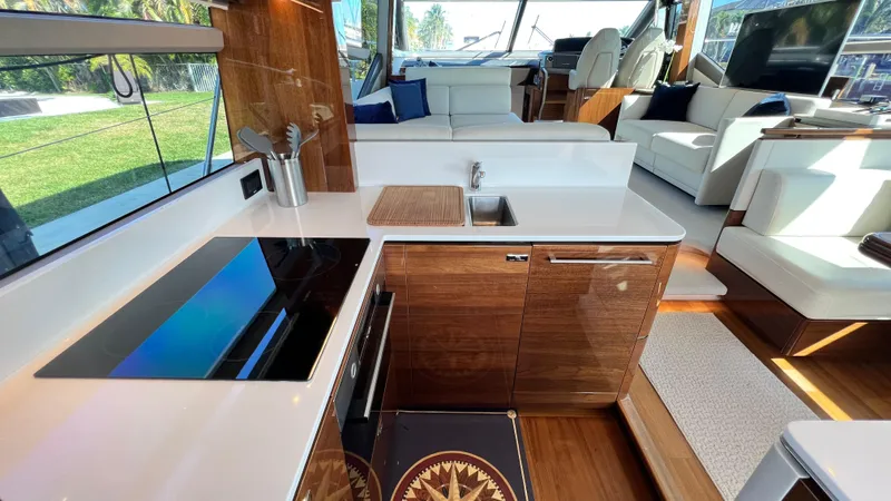 Slide: The Image of Luxurious interior of 2019 Princess F62 yacht with modern kitchen and seating area. - 7