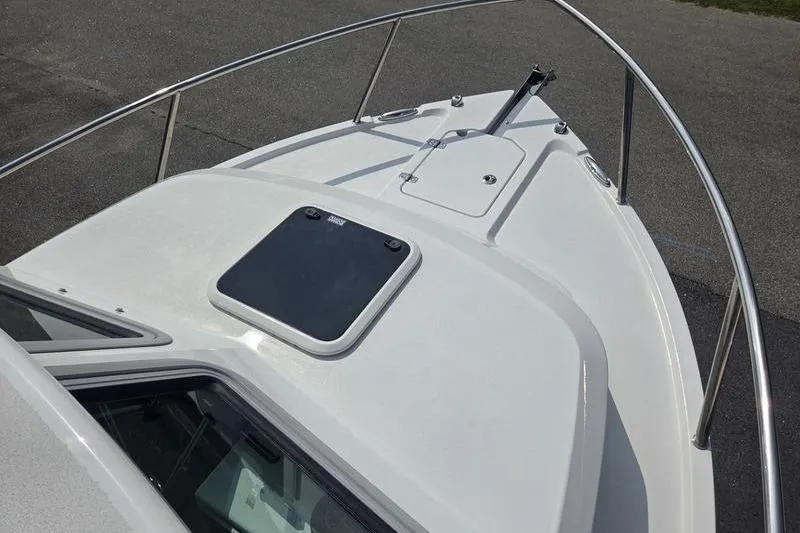 Slide: The Image of Bow of 2026 Parker 2421 EXPLORER boat with sleek design and stainless steel railings. - 5