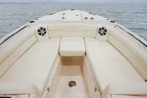 Slide: The Image of 2026 Grady-White Freedom 285 boat interior with spacious seating on open water. - 5