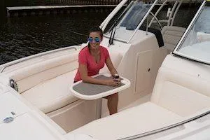 Slide: The Image of Woman relaxing on 2026 Grady-White Freedom 285 boat, enjoying a sunny day. - 8