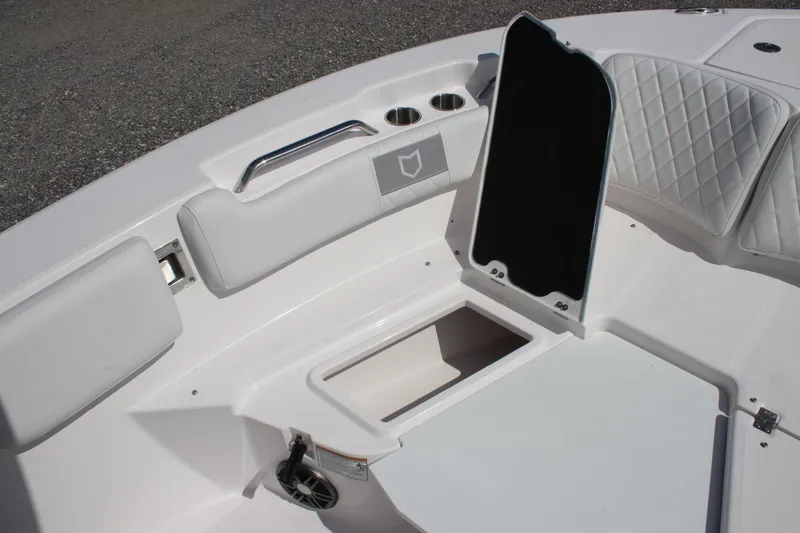 Slide: The Image of 2026 Sea Fox 228 Commander boat interior with open storage compartment and cushioned seating. - 16