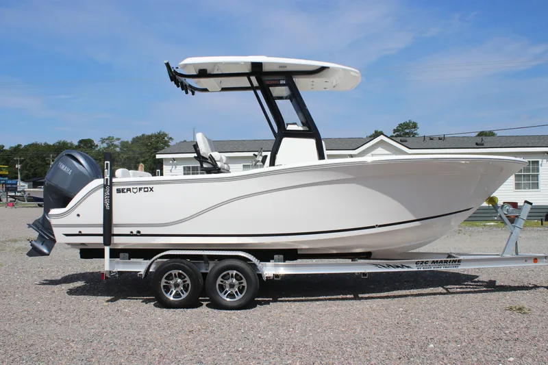 The Image of 2026 Sea Fox 228 Commander boat on trailer, side view, outdoors. - 2