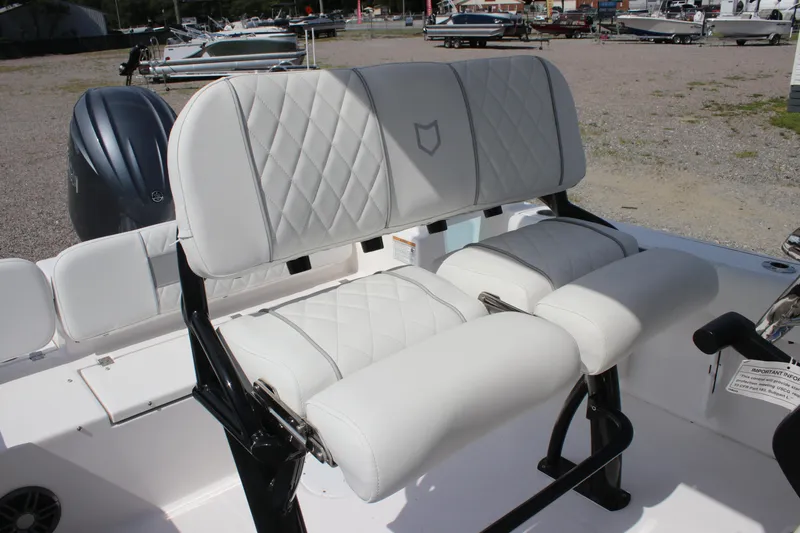 Slide: The Image of 2026 Sea Fox 228 Commander boat with white cushioned seating and sleek design. - 25