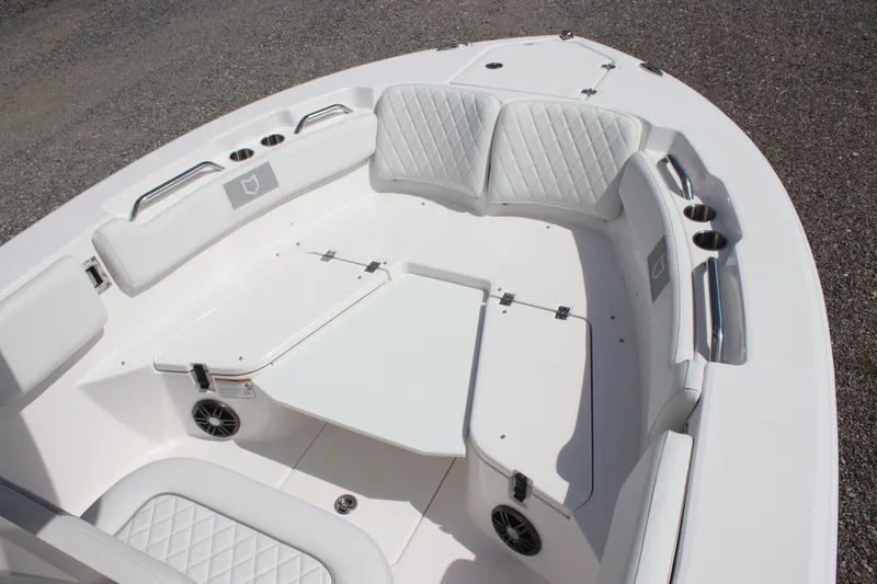 Slide: The Image of 2026 Sea Fox 228 Commander boat interior with white cushioned seating and cup holders. - 29