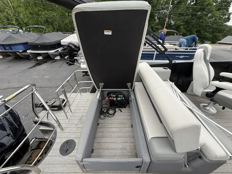 Slide: The Image of 2021 Godfrey Monaco 235 SFL GTP boat with open storage compartment and seating. - 13