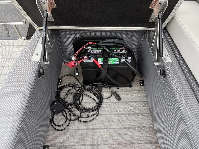 Slide: The Image of Battery compartment of 2021 Godfrey Monaco 235 SFL GTP boat with cables and wiring. - 14