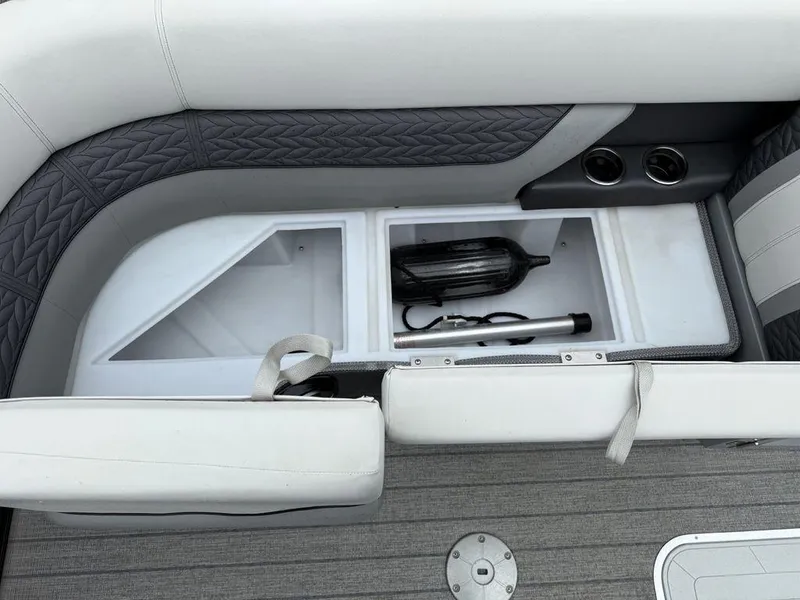 Slide: The Image of 2021 Godfrey Monaco 235 SFL GTP boat storage compartment with seating and cup holders. - 17